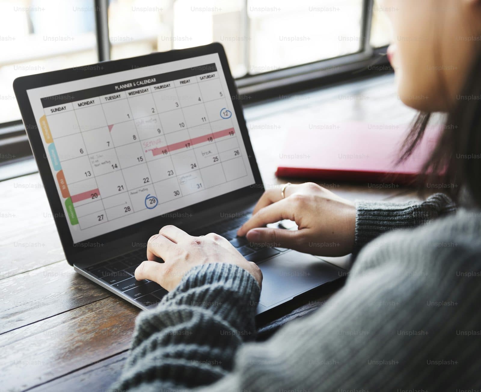 Manager reviewing a weekly schedule on a laptop